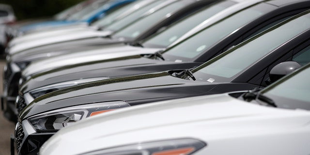 FILE - In this May 19, 2019, file photo, a line of unsold 2019 Tucson sports-utility vehicles sits at a Hyundai dealership in Littleton, Colo. 