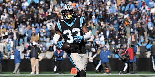 D'Onta Foreman #33 of the Carolina Panthers scores a touchdown during the second quarter of the game against the Detroit Lions at Bank of America Stadium on December 24, 2022, in Charlotte, North Carolina. 