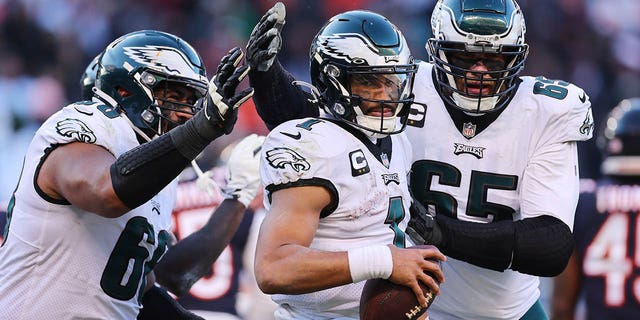 Jalen Hurts, center, of the Philadelphia Eagles celebrates a two-point conversation during the fourth quarter against the Chicago Bears at Soldier Field on Dec. 18, 2022, in Chicago.