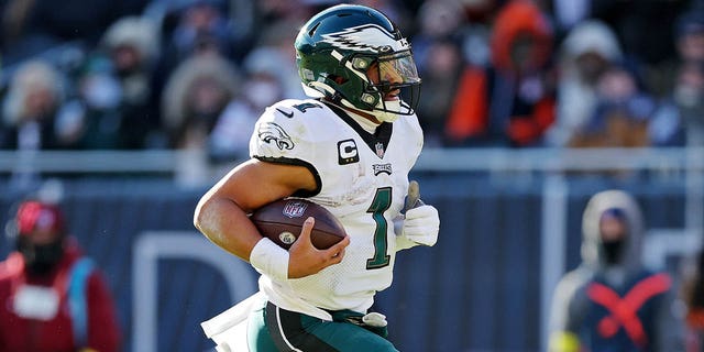Jalen Hurts of the Philadelphia Eagles runs the ball for a touchdown during the second quarter against the Chicago Bears at Soldier Field on Dec. 18, 2022, in Chicago.