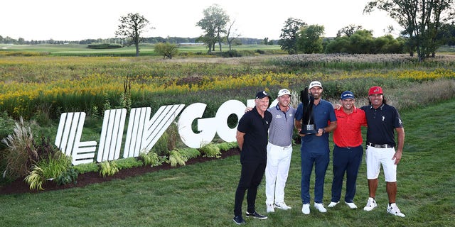 Team captain Dustin Johnson of 4 Aces GC and teammates Pat Perez, Patrick Reed and Talor Gooch pose with Greg Norman, CEO and commissioner of LIV Golf, after winning the team title during at the LIV Golf Invitational - Chicago at Rich Harvest Farms Sept. 18, 2022, in Sugar Grove, Ill.
