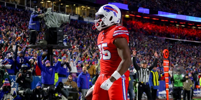 Quintin Morris #85 of the Buffalo Bills celebrates after catching a touchdown pass against the Miami Dolphins during the first quarter of the game at Highmark Stadium on December 17, 2022 in Orchard Park, New York.