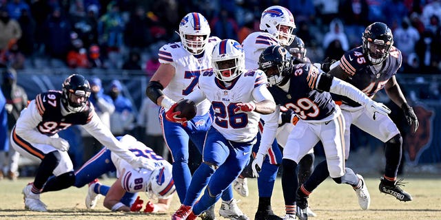 Devin Singletary #26 of the Buffalo Bills runs for a touchdown during the third quarter in the game against the Chicago Bears at Soldier Field on Dec. 24, 2022 in Chicago, Ill.