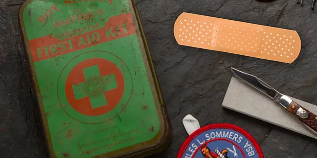 Johnson &amp; Johnson helped popularize Band-Aids by packing them in first-aid kits for Boy Scouts. After an initial kit came in a simple cardboard box, Johnson &amp; Johnson debuted an upgraded BSA first-aid kit in a tin box. Inside, scouts found burn and antibiotic creams, first-aid instructions and several kinds of bandages, including Band-Aids.