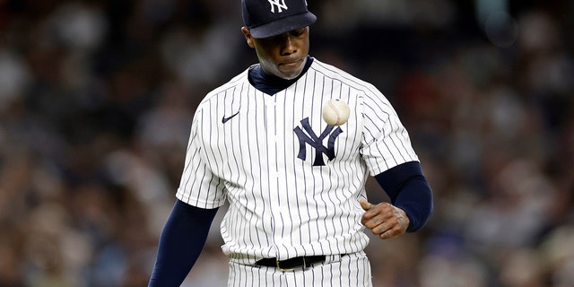 New York Yankees pitcher Aroldis Chapman reacts while he waits to be taken out during the ninth inning of a baseball game against the Toronto Blue Jays, Friday, Aug. 19, 2022, in New York.