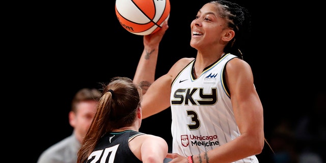 Chicago Sky forward Candace Parker (3) passes the ball over the head of New York Liberty guard Sabrina Ionescu (20) during the first half of a WNBA playoff game Aug. 23, 2022, in New York.