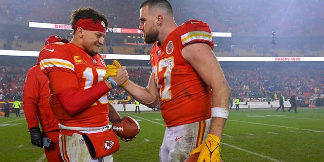 Kansas City Chiefs quarterback Patrick Mahomes, left, and tight end Travis Kelce celebrate a win over Jacksonville in the Divisional Round of the playoffs on Saturday, Jan. 21, 2023, at GEHA Field at Arrowhead Stadium in Kansas City, Missouri. 