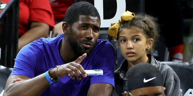 Major League Baseball player Dexter Fowler and his daughter Naya Fowler attend Game 1 of the 2022 WNBA Playoffs' first round at Michelob ULTRA Arena between the Phoenix Mercury and the Las Vegas Aces Aug. 17, 2022, in Las Vegas. The Aces defeated the Mercury 79-63.  