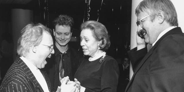 Elaine Steinbeck, wife of author John Steinbeck, at a party for the opening night of the stage adaption of "The Grapes of Wrath." She is pictured with Steppenwolf Theatre Company actor and founder Gary Sinise (second left), set designer Kevin Rigdon (left) and director Frank Galati.