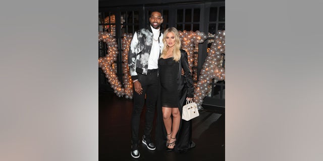 Tristan Thompson and Khloé Kardashian pose for a photo as Remy Martin celebrates Thompson's birthday at Beauty and Essex March 10, 2018, in Los Angeles.