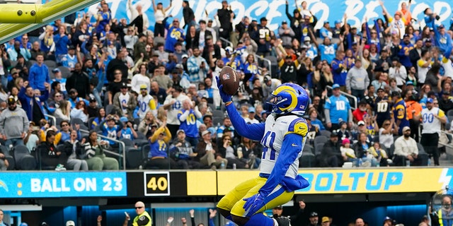 Los Angeles Rams running back Malcolm Brown (41) leaps in the end zone while celebrating his touchdown during the first half of an NFL football game against the Los Angeles Chargers Sunday, Jan. 1, 2023, in Inglewood, Calif. 