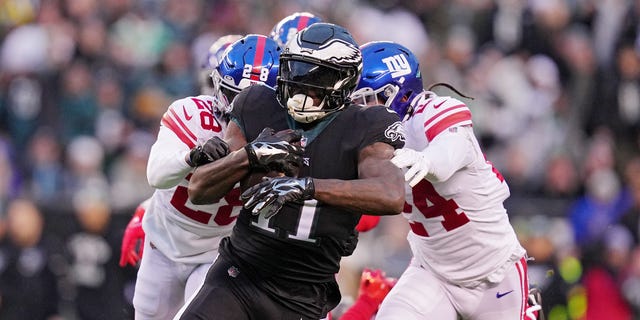A.J. Brown #11 of the Philadelphia Eagles runs past Cor'Dale Flott #28 of the New York Giants during the first quarter against the New York Giants at Lincoln Financial Field on January 08, 2023 in Philadelphia, Pennsylvania.
