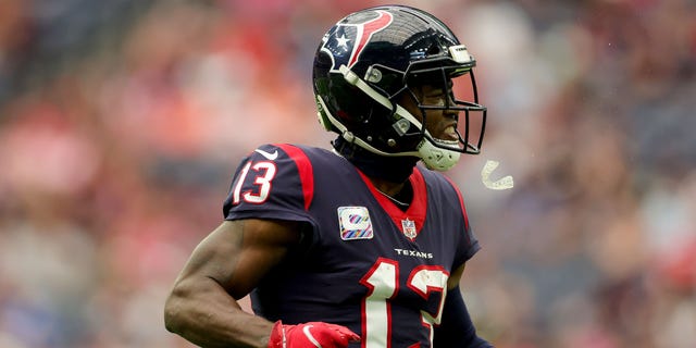 Brandin Cooks, #13 of the Houston Texans, reacts after making a catch in the first quarter against the Los Angeles Chargers at NRG Stadium on Oct. 2, 2022 in Houston.