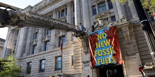 Climate activists protest against fossil fuel development on April 22 in Washington, D.C.