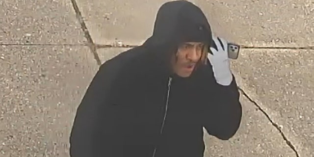 Police released surveillance images of a suspect in the theft of a funeral home van that held a dead body on Saturday.