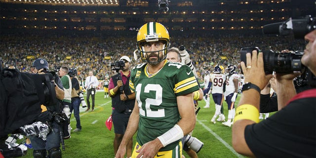 Packers quarterback Aaron Rodgers walks off the field after defeating the Chicago Bears, 27-10, on Sept. 18, 2022, at Lambeau Field in Green Bay, Wisconsin.