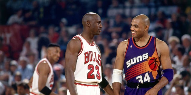 Charles Barkely (34) of the Phoenix Suns chats with Michael Jordan (23) of the Chicago Bulls in Game 5 of the 1993 NBA Finals June 18, 1993, at Chicago Stadium in Chicago.