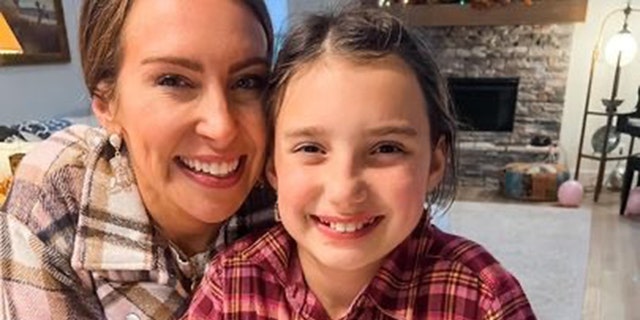Ginny Lauren Dowden, shown here with her daughter, Roslyn, fought for her little girl to remain mask-free despite school mask mandates in their town in Fayetteville, Arkansas. 