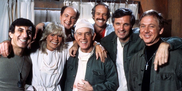 "MASH" sitcom actors, from left, Jamie Farr, Loretta Swit, David Ogden Stiers, Harry Morgan, Mike Farrell, Alan Alda and William Christopher in publicity portrait, circa 1978.