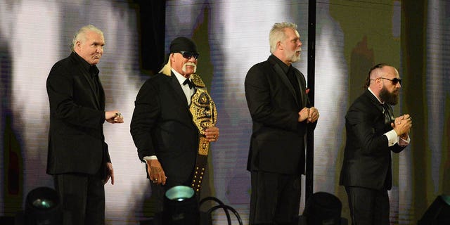 WWE Hall of Fame inductees Scott Hall, Hulk Hogan, Kevin Nash and Sean Waltman greet fans during WrestleMania 37 at Raymond James Stadium in Tampa, Fla., April 10, 2021.