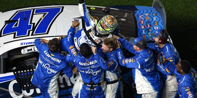 Ricky Stenhouse Jr., driver of the #47 Kroger/Cottonelle Chevrolet, celebrates with his crew after winning the NASCAR Cup Series 65th Annual Daytona 500 at Daytona International Speedway on Feb. 19, 2023.