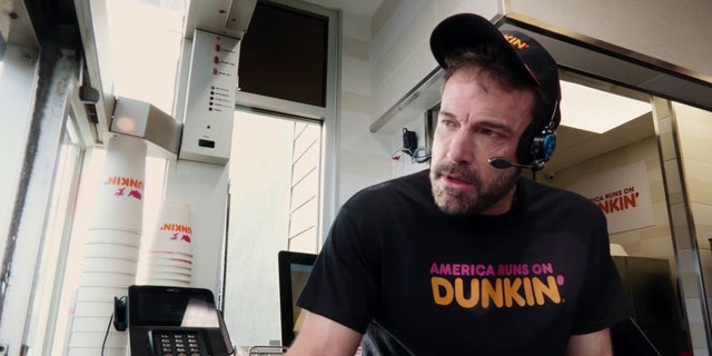 Ben Affleck works the drive-thru in Dunkin's Super Bowl ad.