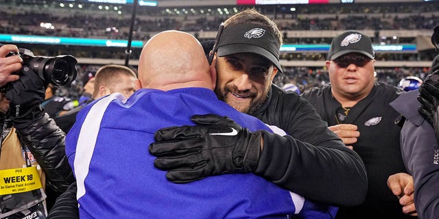 Head coach Nick Sirianni of the Eagles hugs Giants' head coach Brian Daboll after Philadelphia beat New York, 22-16, at Lincoln Financial Field on Jan. 8, 2023.