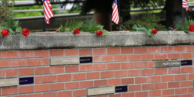 The Portland Police Bureau released a photo of what the memorial to fallen police officers at Tom McCall Waterfront Park looked like before it was vandalized.