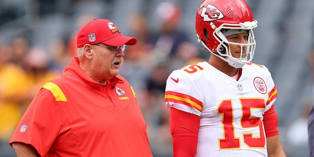 Head coach Andy Reid and Patrick Mahomes of the Kansas City Chiefs talk prior to a preseason game against the Bears at Soldier Field on Aug. 13, 2022, in Chicago.