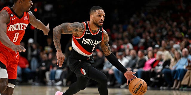 Damian Lillard (0) of the Portland Trail Blazers drives against the Houston Rockets in the first quarter at the Moda Center Feb. 26, 2023, in Portland, Ore.