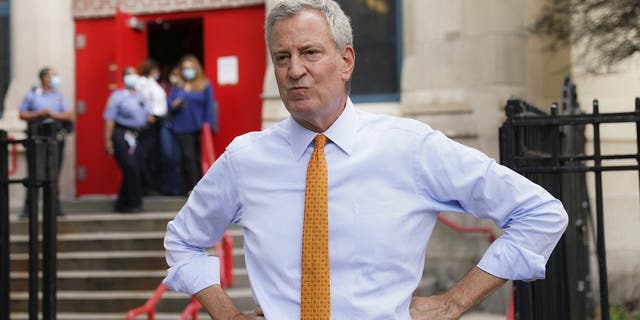 In this Aug. 19, 2020, file photo, then-New York City Mayor Bill de Blasio speaks to reporters after visiting New Bridges Elementary School in the Brooklyn borough of New York, to observe pandemic-related safety procedures.