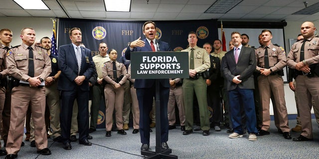 Florida Gov. Ron DeSantis arrives to announce a proposal for an increase in pay for state law enforcement agencies to encourage more officers to relocate to Florida.