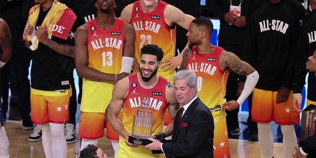Team Giannis forward Jayson Tatum (0) receives his MVP trophy after the NBA All-Star Game Feb. 19, 2023, in Salt Lake City. 