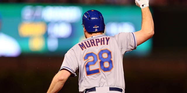 Daniel Murphy, #28 of the New York Mets, rounds the bases after hitting a two run home run in the eighth inning against Fernando Rodney, #57 of the Chicago Cubs, during game four of the 2015 MLB National League Championship Series at Wrigley Field on Oct. 21, 2015 in Chicago.