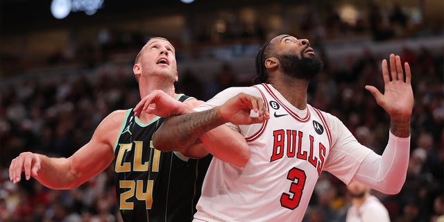 Charlotte Hornets Center Mason Plumlee, #24, and Chicago Bulls Center Andre Drummond, #3, battle for position under the basket during a NBA game between the Charlotte  Hornets and the Chicago Bulls on Feb. 2, 2023 at the United Center in Chicago.
