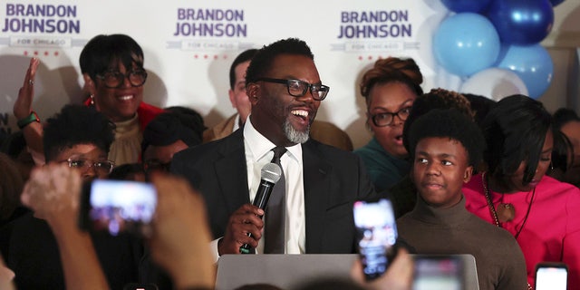 Brandon Johnson speaks with supporters after forcing a mayoral runoff election during his election night gathering on Feb. 28, 2023, in Chicago.