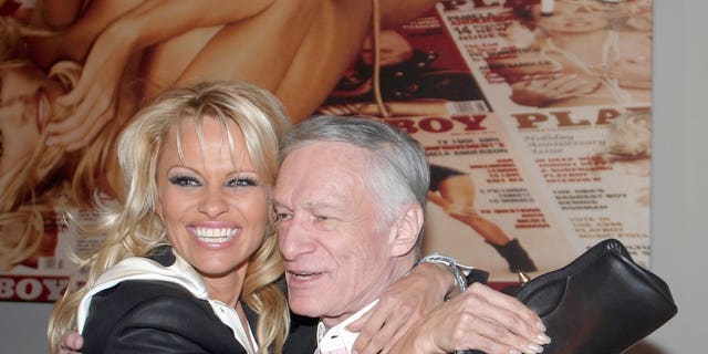 Pamela Anderson, left, and Hugh Hefner during the Hugh Hefner and International Images Launch the Playboy Legacy Collection.