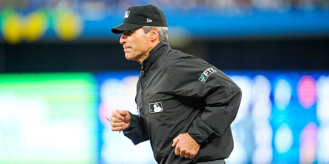 Umpire Angel Hernandez looks on as the Toronto Blue Jays play the Minnesota Twins in the sixth inning during their MLB game at the Rogers Centre on June 3, 2022, in Toronto, Ontario, Canada. 