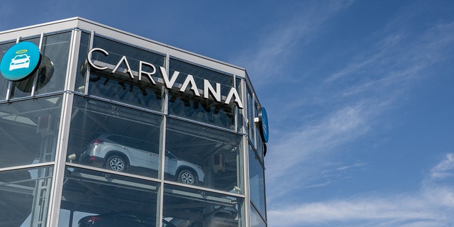 Vehicles are seen on a display at a Carvana dealership on February 20, 2023, in Austin, Texas. 