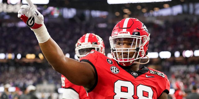 Georgia defensive lineman Jalen Carter waves to the crowd before the national championship playoff game against TCU, Jan. 9, 2023, in Inglewood, California.