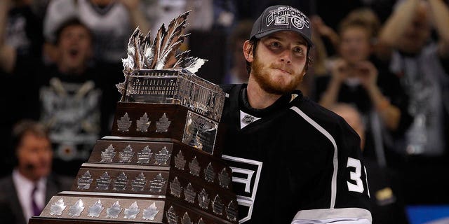 Goaltender Jonathan Quick, #32 of the Los Angeles Kings, holds the Conne Smythe Trophy for the Most Valuable Player in the NHL Playoffs after the Los Angeles Kings defeated the New Jersey Devils 6-1 in Game Six to win the series 4-2 of the 2012 Stanley Cup Final at Staples Center on June 11, 2012 in Los Angeles.