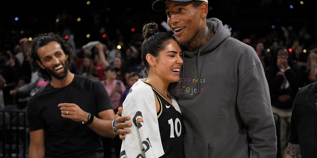 NFL player, Darren Waller embraces Kelsey Plum #10 of the Las Vegas Aces after Round 1 Game 1 of the 2022 WNBA Playoffs on August 17, 2022 at Michelob ULTRA Arena in Las Vegas, Nevada.