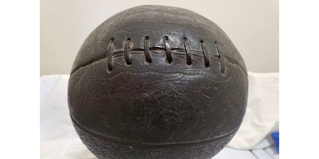 An early-era laced basketball, used by Mount Vernon High School in its 1920 Illinois state championship season. H.V. Porter, the Illinois administrator who coined "March Madness," also pioneered the use of molded basketballs, making laced versions obsolete.