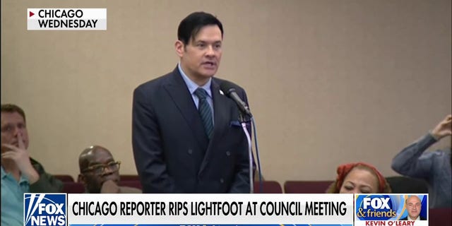 Reporter William Kelly calls out Chicago Mayor Lori Lightfoot at a city council meeting. 