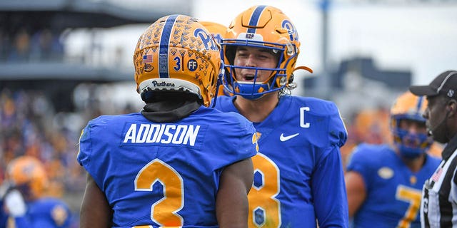 Jordan Addison of the Pittsburgh Panthers celebrates with Kenny Pickett (8) after a 23-yard touchdown in the second quarter against the Clemson Tigers at Heinz Field Oct. 23, 2021, in Pittsburgh. 