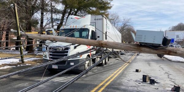 Driver trapped under downed utility wires near Boston
