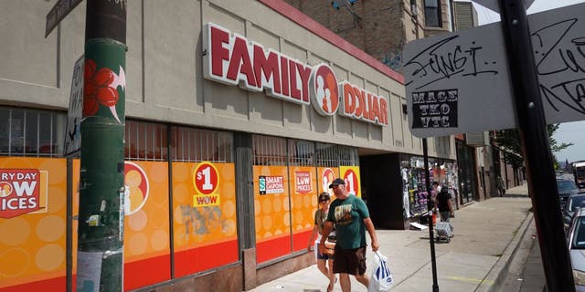 Pedestrians walk past a Family Dollar store in Chicago, Illinois