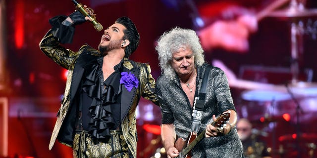 Adam Lambert, left, and Brian May of Queen + Adam Lambert perform in Chicago on Aug. 9, 2019.