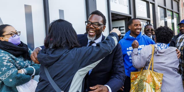 Chicago mayoral candidate Brandon Johnson hugs Rhoda Rae Gutierrez at campaign stop at 6th Ward aldermanic candidate William Hall's office Sunday, April 2, 2023.