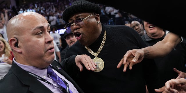 Rapper E-40 yells at arena security personnel before being escorted from courtside seating during Game One of the Western Conference First Round Playoffs between the Golden State Warriors and Sacramento Kings at the Golden 1 Center on April 15, 2023 in Sacramento, California.